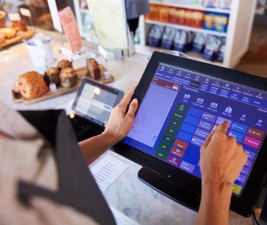 close-up-female-employee-working-delicatessen-checkout